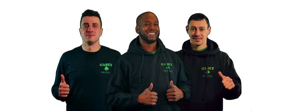 Three Casey Movers crew members in Casey hoodies giving thumbs up